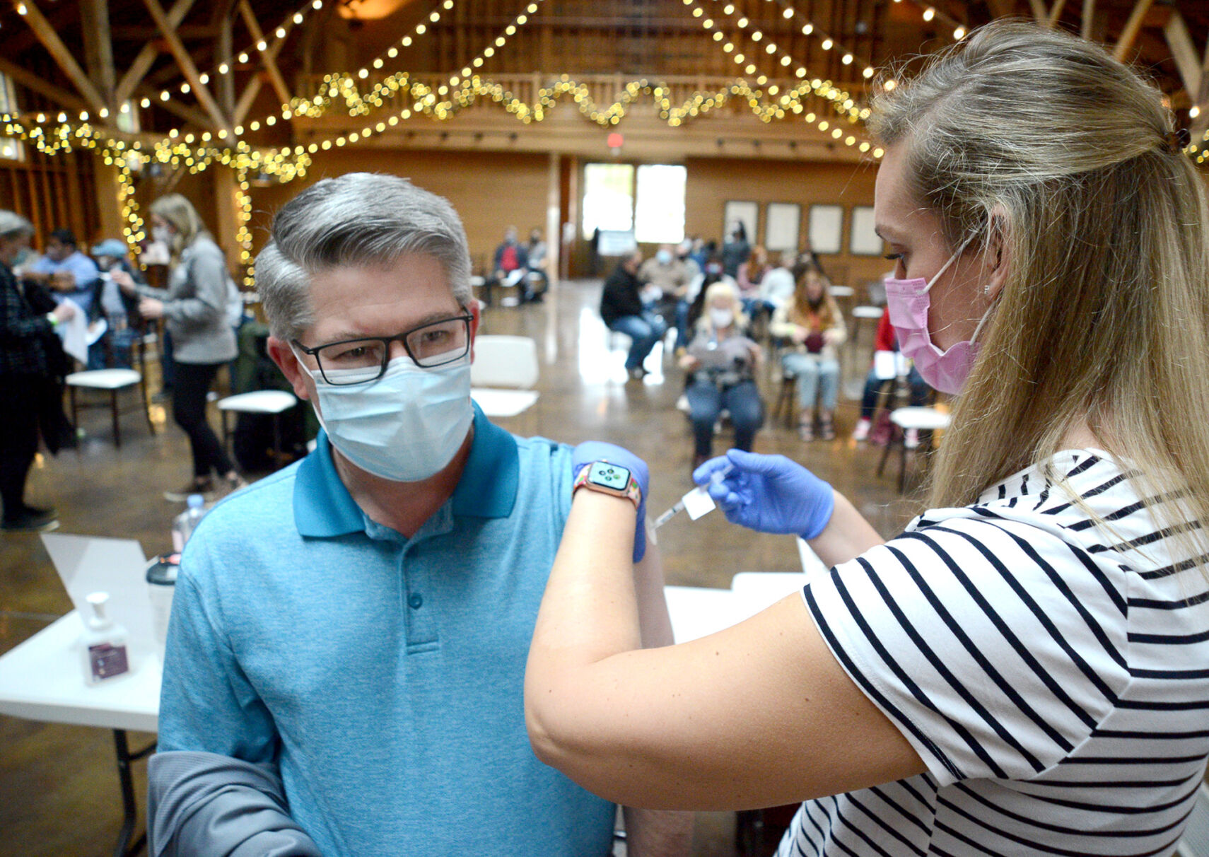 John Elmore of The O'Neal School receives his first dose of the COVID-19 vaccine at the Fair Barn in Pinehurst
